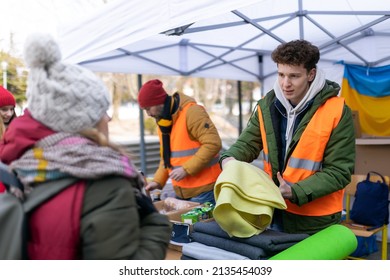 Volunteers Distributing Blankets And Other Donations To Refugees On The Ukrainian Border.