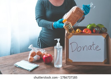 Volunteers With Donation Boxes For The Needy And Provide Essential Supplies To Help During The Plague Covid-19.