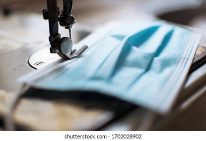 Volunteers And Workers Are Making Surgical Masks For Hospitals As An Outbreak Of COVID 19 Causes A Severe Shortage Of Medical Supplies. Extremely Narrow Depth Of Field.