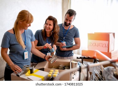 Volunteers working in charitable foundation Warehouse on helping homeless people.Social workers who provide humanitarian assistance to a disadvantaged person