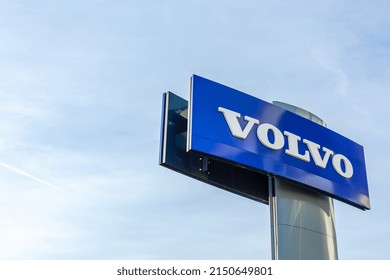 Volvo brand logo on bright blue sky background located on its sale office building in Lyon, France - February 23, 2020