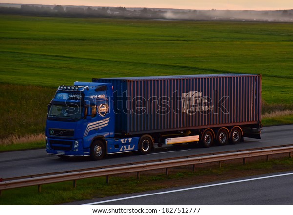 Volvo FH 460 Semi Truck\
transport the sea container by PJSC TransContainer on highway.\
Shipping Containers, Maritime logistics. MINSK, BELARUS - SEPT 07,\
2020