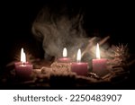 Voodoo doll, black candles, pentagram and old books on witch table. Occult, esoteric, divination and wicca concept. Mystic, voodoo and vintage background