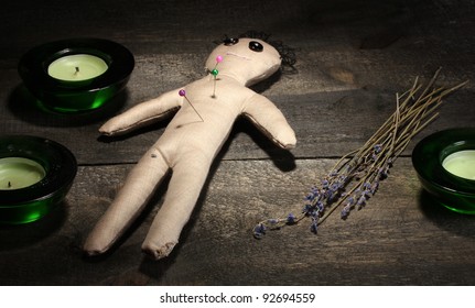 Voodoo Doll Boy On A Wooden Table In The Candlelight