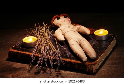 Voodoo Doll Girl On A Wooden Table In The Candlelight