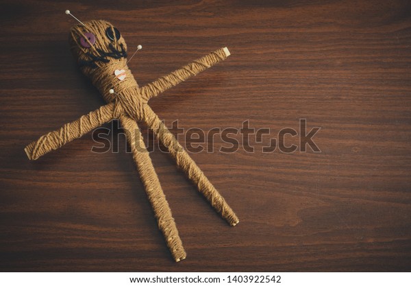 wooden voodoo doll