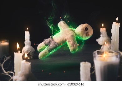 Voodoo Doll On A Wooden Background With Dramatic Lighting