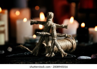 Voodoo dolls on table in dark room. Curse ceremony - Shutterstock ID 2008945016
