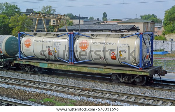 VORONEZH REGION, RUSSIA -\
SEPTEMBER, 2016: Railway platform with two tank containers ISO 22K4\
for transportation of liquid dangerous goods as part of a freight\
train\
