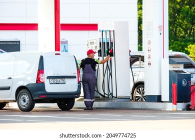 Voronezh. Russia. July 23, 2021. A Uniformed Tanker Refueling A White Van At A Gas Station.