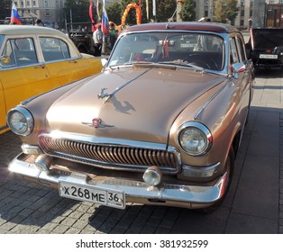 VORONEZH, RUSSIA - Sep.19, 2015: Soviet Executive Car Of 1960s Sedan GAZ M21 Volga The Third Series (Baleen) Brown Color With Leaping Deer Hood Ornament. Vintage Car Parade On The City Central Square 