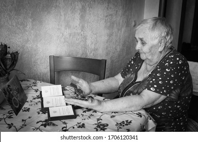 Voronezh/Russia - April 2020: Participant With Orders And Medals On May 9 At The Home.  Portrait Of A Woman-veteran Of The Second World War In Medals In The Interior Of The House