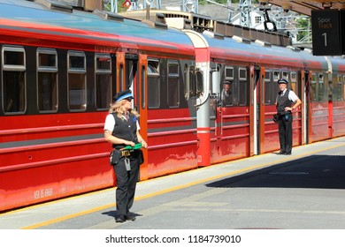 Voss, Norway - June 25, 2018: Train Conductors On The Platform Of Voss Railway Station, The Main Rail Transportation Hub In The Village Of Vossevangen, Hordaland County.