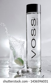 Voss Water Bottle With A Splash Made With A Lemon