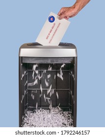 Vote By Mail Or Absentee Ballot Being Shredded In Office Paper Shredder As Illustration Of Voting Fraud Or Lost Votes In Presidential Election