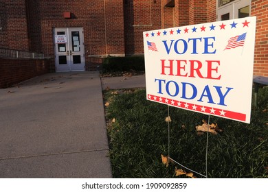 A Vote Here Today Sign Stands Outside Of A Polling Place.