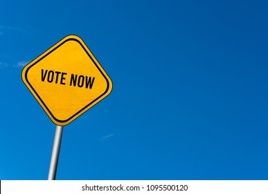 vote now - yellow sign with blue sky