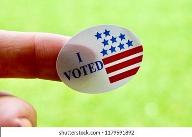 I Voted Sticker On A Woman’s Finger