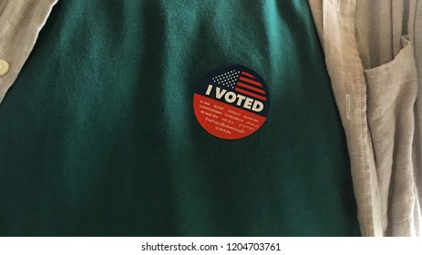 I Voted Sticker On A Green T Shirt