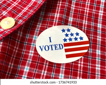 I Voted Sticker On A Man’s Red Plaid Shirt