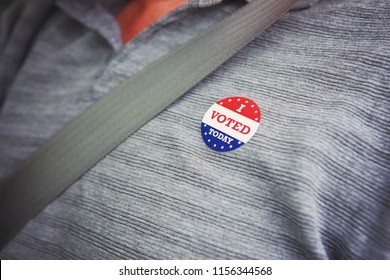 I Voted Today Sticker On A Mans Shirt After Voting