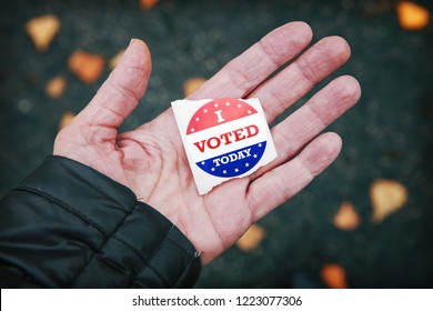 I Voted Today Sticker In A Persons Hand After Voting