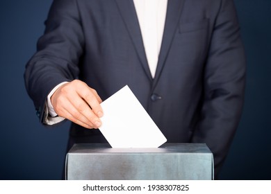 Voter putting vote in the ballot box. Election concept.