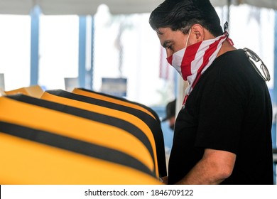 A Voter Wearing A Face Mask Casts His Ballot At A Vote Center In Dodgers Stadium During The Election Day In Los Angeles, Tuesday, Nov. 3, 2020.