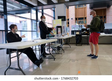 Voters cast their ballot  in a polling station during the second round of the French Municipal elections in Lille, France on June, 28th 2020
