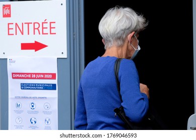 Voters Queue Outside Of A Polling Station During The Second Round Of The French Municipal Elections In Lille, France On June, 28th 2020