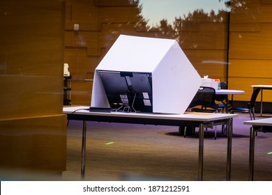 Voting machine after hours, voter fraud, civic duty, civic engagement, democracy, voting machine in a polling place, election 2022