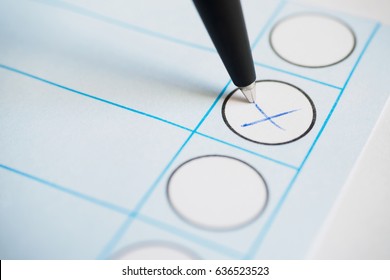 Voting paper or ballot paper with pen and marked cross