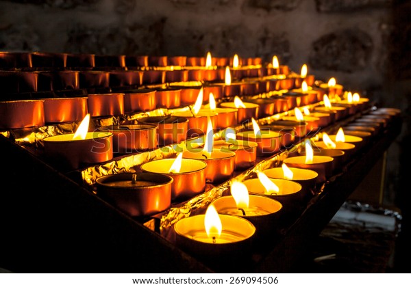 Votive\
Candles in a Group burnt to pray for Someone\
Else