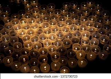 Votive Candles Lit In The Church