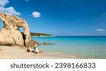 Voulisma Beach Istron Crete Greece, beautiful beaches of Crete island Istron Bay near Agios Nikolaos. A young couple on vacation in Greece Crete during the summer holidays vacation