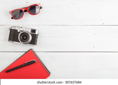 Voyage concept - set of cool photography stuff on wooden background