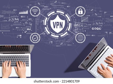 VPN Concept With People Working Together With Laptop Computers