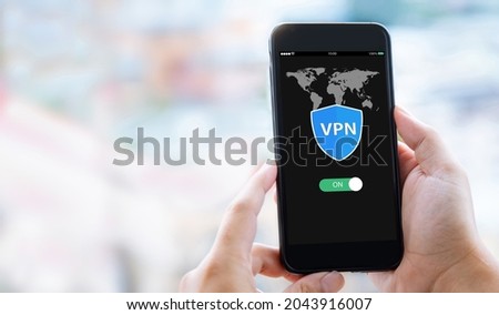VPN Internet protocols private network concept.Man hands holding mobile phone