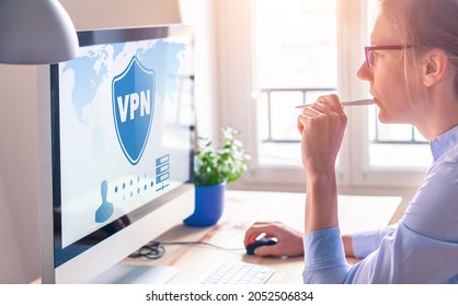 VPN secure connection for freelancer Person using Virtual Private Network technology on computer to create encrypted tunnel to remote server on internet to protect data privacy, home office.