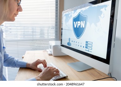 VPN secure connection for telecommuter. Person using Virtual Private Network technology on computer to create encrypted tunnel to remote server on internet to protect data privacy, home office.