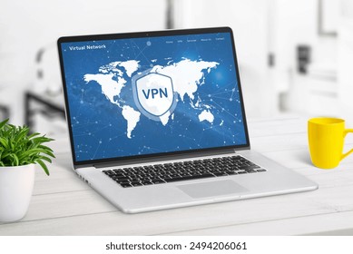 VPN web page service on laptop display displaying a world map with VPN locations. Highlights global network access, online security, and privacy protection