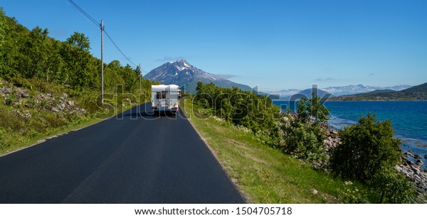 VR Caravan car
travels on the highway. Tourism vacation and traveling. Beautiful
Nature Norway natural
landscape.