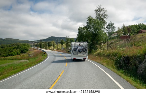 VR Caravan car
travels on the highway. Tourism vacation and traveling. Beautiful
Nature Norway natural
landscape.
