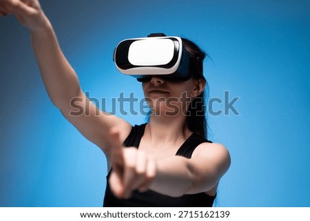 VR designer interacting with virtual controls while developing digital concepts in immersive environment