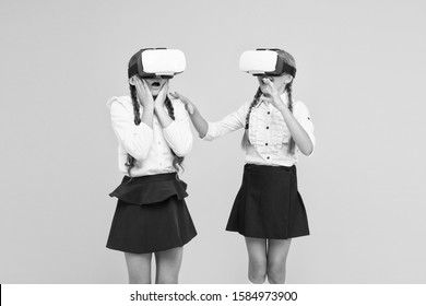 VR headset. Future education. Children schoolgirls wear wireless VR glasses. Exploring augmented reality. Experiences communicate and manage projects.Kids use modern VR technology. Virtual reality.