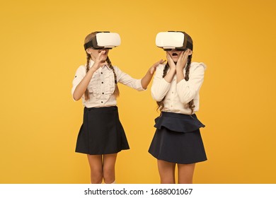 VR headset. Future education. Children schoolgirls wear wireless VR glasses. Exploring augmented reality. Experiences communicate and manage projects.Kids use modern VR technology. Virtual reality.