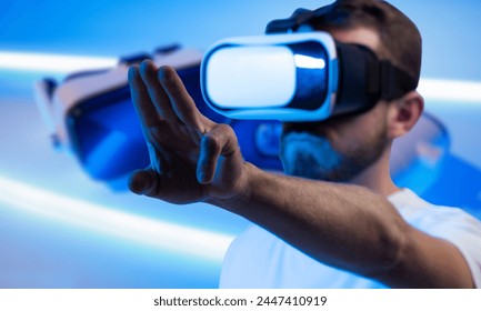 VR technology offers immersive experiences by transporting users to virtual environments, blurring the boundaries of reality and unlocking new realms of entertainment, education, and adventure. - Powered by Shutterstock