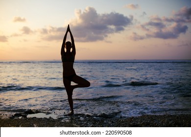 Vrikshasana Tree Pose From Yoga By Woman Silhouette On Sunset