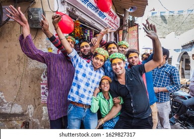Vrindavan, India - March 12 2017: Indian people covered in different colours celebrating Holi festival in Vrindavan, India. - Shutterstock ID 1629827317