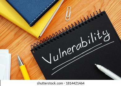 Vulnerability Is Written In White Pencil On A Black Page.